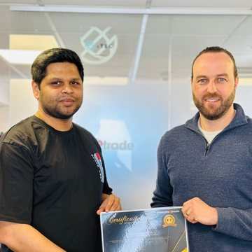Vignesh receiving their trading certificate